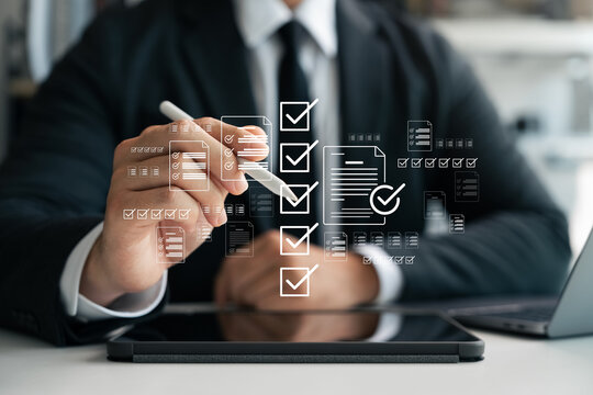 Business checklist management and performance tracking, businessman using laptop with digital document icons check mark and online document approval, digital form checklist, filling out online survey. - Powered by Adobe