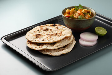 Indian food Tandoori roti or nan, Indian flat bread with Mix vegetable curry  