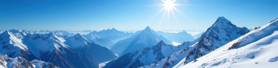 Fototapeta premium Sunlit snow-covered mountain range, deep blue sky , clouds, snow