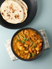 Indian food Tandoori roti or nan, Indian flat bread with Mix vegetable curry  
