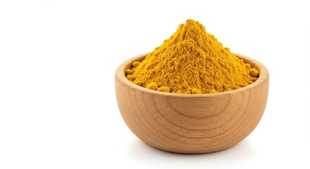 A wooden bowl filled with a vibrant mound of turmeric powder on a clean white background image view