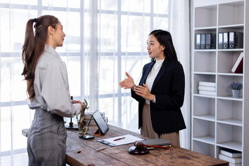 Successful two female in formal suit insurance broker lawyer consult client on workplace  justice and lawyer Business partnership meeting concept.