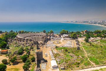 Obraz premium Side Ancient Theatre, Manavgat. Aerial drone image of the ancient city and amphitheater of Side in Antalya, Turkiye.