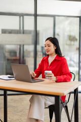 Fototapeta premium Business Employee Asian woman working on laptop document archives on folders papers at busy work at desk workplace office. Business Documents concept. 
