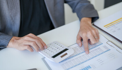 Fototapeta premium Confident asian business man Auditor or internal revenue service staff checking annual financial statements company Audit &nbsp;Accounting tax.