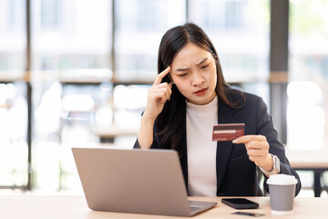 Transfer money online business asian woman using bank payment card. Hands input credit card data...