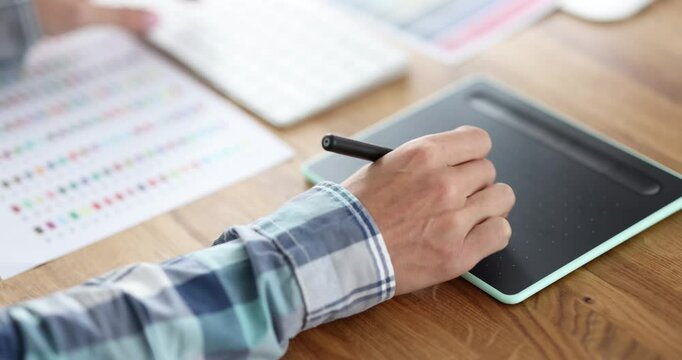 Businessman writes electronic signature on screen of digital tablet. Office worker signs official document displayed on tablet using digital stylus