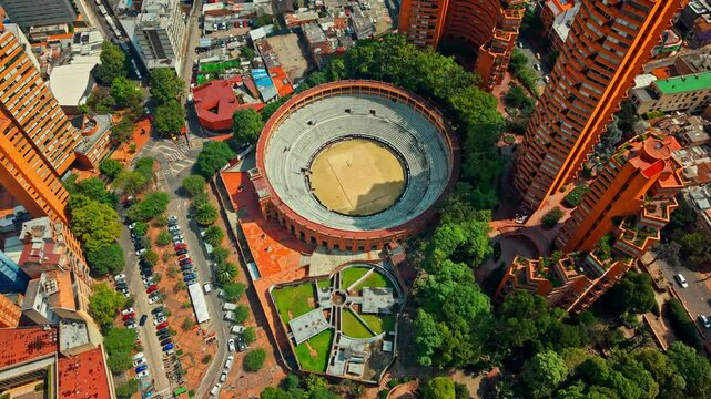 Aerial orbit establishing of La Santamar&iacute;a bullring, a heritage building in Bogota, Colombia, on a sunny day in La Macarena neighborhood.