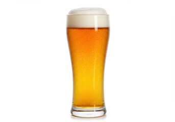 Close up of a pilsner glass filled with beer and a thick head of foam on a white background isolated