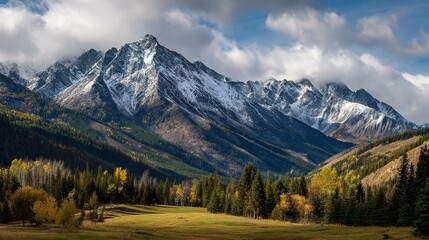 Fototapeta premium Majestic mountain range and valley in autumn foliage.
