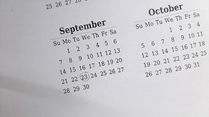 marking 23 September date on the calendar	
