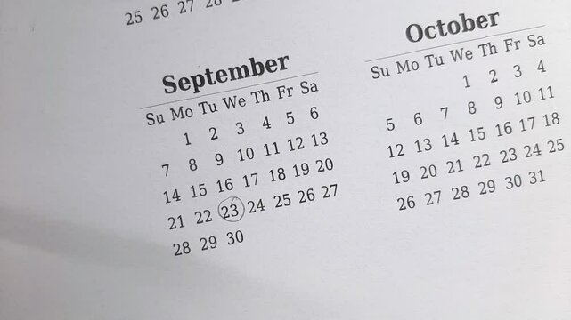 marking 23 September date on the calendar	
