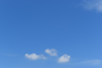 beautiful blue sky and white fluffy group of clouds with sunrise in the morning, natural background