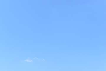 beautiful blue sky and white fluffy group of clouds with sunrise in the morning, natural background