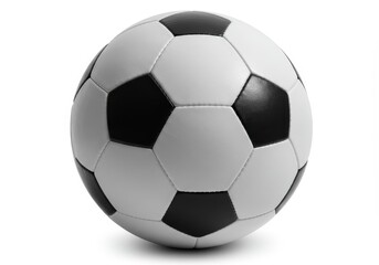 A classic black and white soccer ball isolated on a white background in a well lit studio shot