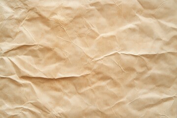 Fototapeta premium Close-up view of crumpled light beige wrapping paper texture.