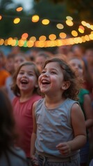Fototapeta premium Joyful young children laughing at outdoor evening festival