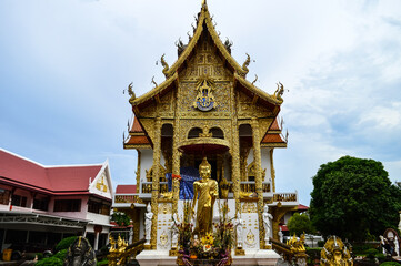 Fototapeta premium Pagoda and Chapel, Lanna Architecture, Symbols of Buddhism, South East Asia at Wat Buppharam, Chiang Mai, Northern Thailand
