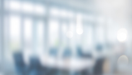 Blurred office interior with table chairs and bright light creates soft background. Professional photos for backgrounds for text, banners, posters, and web displays.