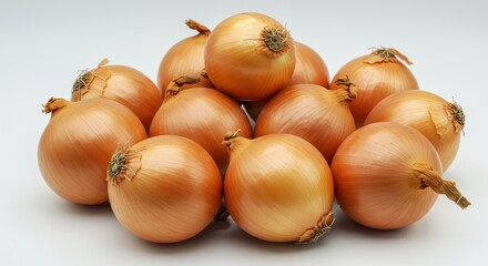 A close up shot of a pile of golden onions with white background in a studio setting for food photography
