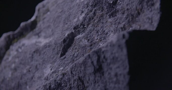 Shifting light grazes the edge of an ancient Drombeg stone, casting shadows that echo with quiet power and timeless ritual.