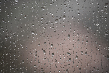 Raindrops on Window With Blurry Overcast Background