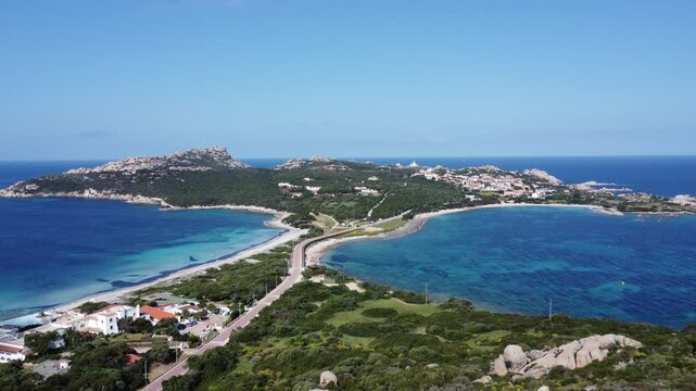 drone flies over the peninsula of capo testa in sardinia, with amazing turquoise watercolor