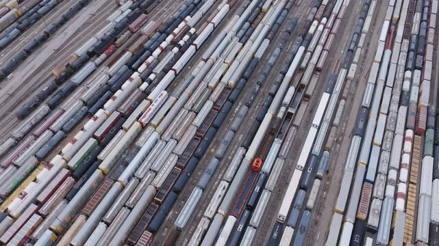 Aerial footage panning across all the waiting trains at the train yard in Chattanooga, TN.