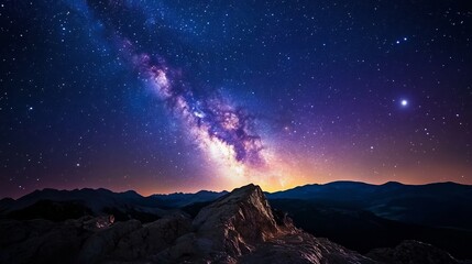 Fototapeta premium Majestic Milky Way Over Mountain Peaks: A Night Sky Panorama