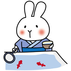 青い浴衣を着て金魚すくいをする白いうさぎ