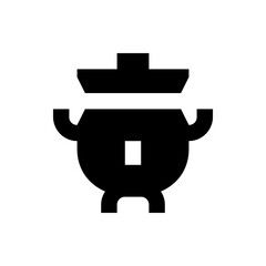 Illustration of a black cauldron with a lid and handles, featuring a small square opening on its body