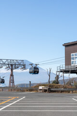 Hakone, Japan - November 9, 2024: View of Mount Fuji and Hakone Ropeway Owakudani Station