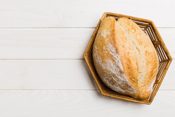 Freshly baked bread on basket against natural background. top view bread copy space