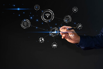 Businessman holding pen pointing at virtual touch screen interface icon. Business connection...
