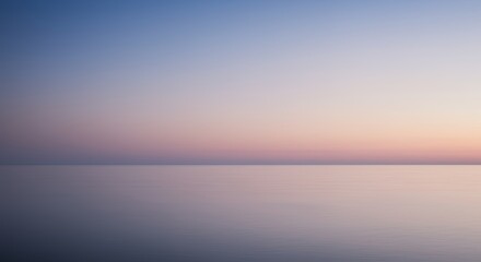 Obraz premium Peaceful pastel sunrise over calm water