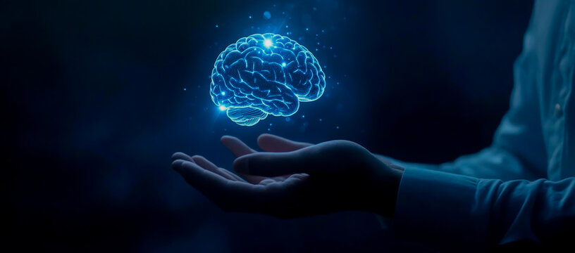 Businessman Holding a Brain Hologram in His Hands on a Dark Blue Background