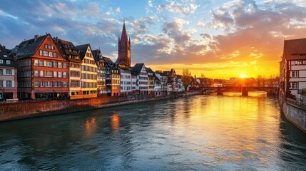 Obraz premium A European cityscape with historic buildings at sunset.