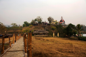 Su Tong Pae bamboo wooden bridge of Wat Phu Sa Ma temple for thai people and foreign traveler...