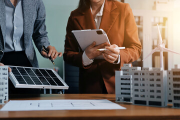 Discussion among businesspeople on the latest developments in solar cell panel technology and Solar...