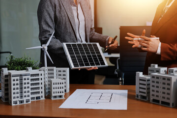 Discussion among businesspeople on the latest developments in solar cell panel technology and Solar...