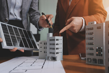Discussion among businesspeople on the latest developments in solar cell panel technology and Solar...