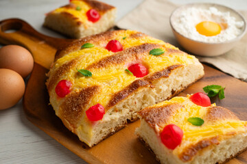 Coca San Juan, a traditional Catalan dessert similar to brioche with pastry cream and candied...