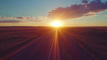 Aerial view of endless highway stretching into horizon under golden sunset, symbolizing boundless opportunities and journey to success. Road trip, travel adventure and freedom concept.