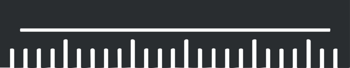Close-up of a white ruler with measurement markings on a black background for precise length measurement