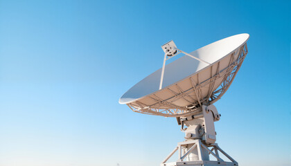 Satellite dish against clear blue sky  