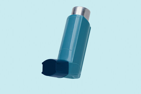 Close up still life of blue inhaler on blue background
