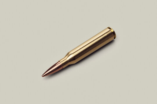 Studio shot .338 bullet cartridge on white background
