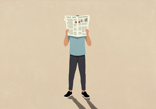 Man's eyes peeking out holes in newspaper

