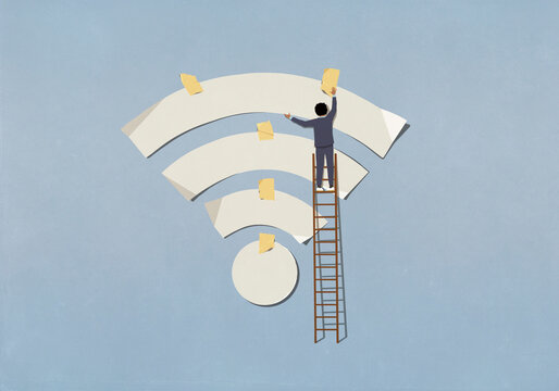 Businessman on ladder taping Wi-Fi symbol to blue background
