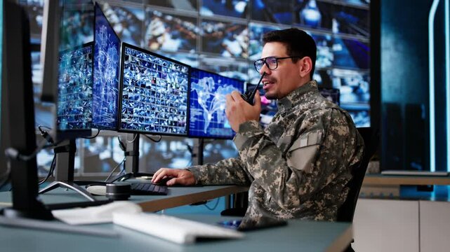 Hispanic Surveillance Specialist Monitoring Security Cameras